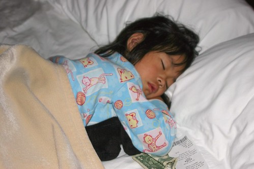 Olivia Sleeping with Puppy and Money