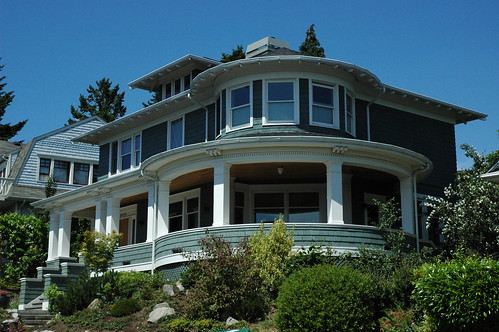 Rotunda porch house, teal gray and white trim, clear day in summer, Greenlake, Seattle, Washington, USA by Wonderlane