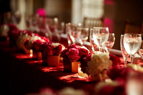 Orange red and pink wedding table setting