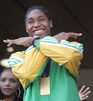 Caster Semenya's triumphant return to South Africa on August 24, 2009 at Oliver Tambo International Airport. The gold medalist has been subject to racist attacks that began in Berlin questioning her gender. by Pan-African News Wire File Photos