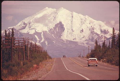 View East Along Glen Highway Toward Mount Drum (Elevation 12,002 Feet) and Intersection of Road and Trans-Alaska Pipeline...08/1974