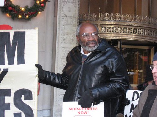 Abayomi Azikiwe, editor of the Pan-African News Wire, covering a demonstration held by the Moratorium Now! Coalition on November 20, 2008 outside the state office building, Cadillac Plaza in Detroit. (Photo: Alan Pollock). by Pan-African News Wire File Photos