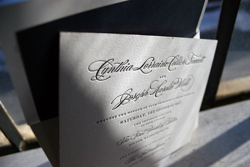 A classic letterpress wedding invitation in black ink printed by Bella 