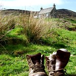 Unoccupied hiking boots on a lovely hillside after a hard day's walk, by David Maters