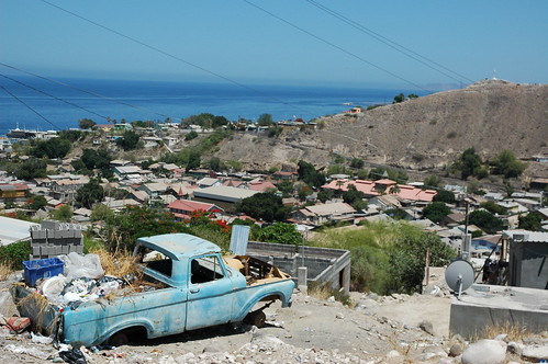 Where a black dog lives inside a blue pickup truck loaded with junk, no wheels, The city of wood, French influenced, mining town, Sea of Cortez, San Rosalia, Baja California Sur, Mexico by Wonderlane