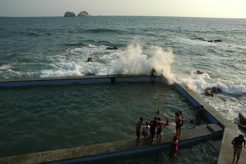 Back massage by wave splashing in! Pacific Ocean pool with kids and adults, South Mazatlan, Sinaloa, Mexico by Wonderlane
