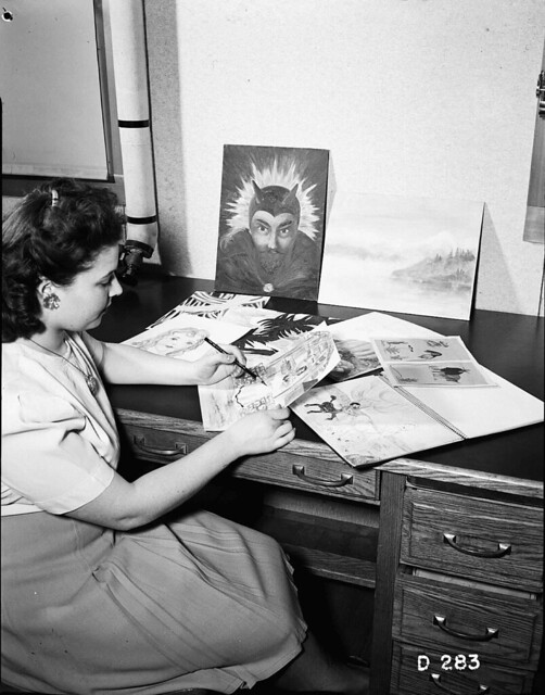 1944 HANFORD WOMAN REVIEWING ART WORK