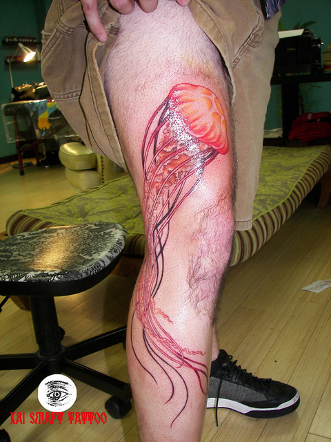 This jellyfish tattoo is very long as it is also on a tall man