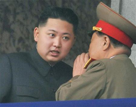 Democratic People's Republic of Korea (DPRK) official Kim Jong-un consults during the commemorations in honor of the 65th anniversary of the formation of the ruling Worker's Party of North Korea. The parade was held on Oct. 10, 2010 in Pyongyang. by Pan-African News Wire File Photos