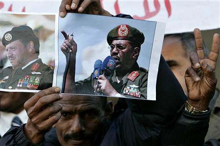 Sudanese masses hold posters of President Omar al-Bashir in a demonstration protesting the arrest warrant issued by the ICC. The government has dismmised the warrant as an imperialist plot to overthrow the state. by Pan-African News Wire File Photos