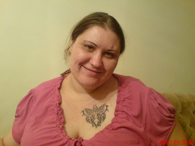 my wife with her tattoo's there is the one on her chest and her eyebrows