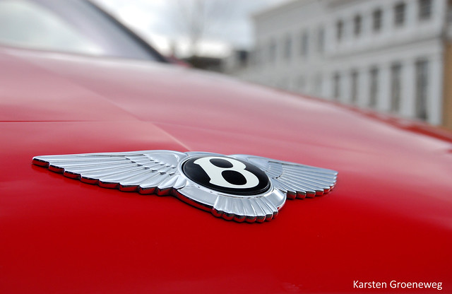Bentley logo on this beautiful red Bentley Continental GT