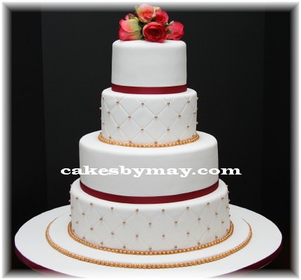 square wedding cake with pink gerbera