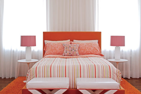 Colorful, modern bedroom: Pink + orange + white + Saarinen side tables