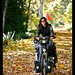 Ivana cycling over fall leaves
