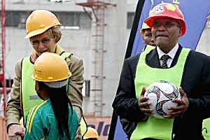 President Jacob Zuma and Western Cape Premier Helen Zille (obscured by child greeting her) are seen during a visit to Green Point stadium in Cape Town with 365 days to kick-off of the 2010 Fifa World Cup, Thursday, 11 June 2009.  by Pan-African News Wire File Photos