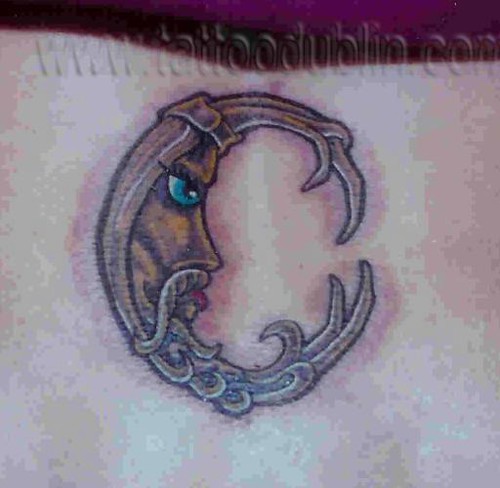 funky little moon tattoo by dublin ireland tattoo artist'Pluto'