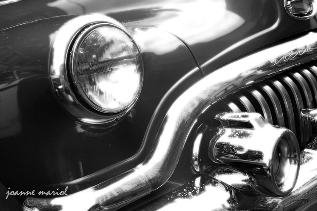 Unique black and white detail image of a classic car grill by photographer