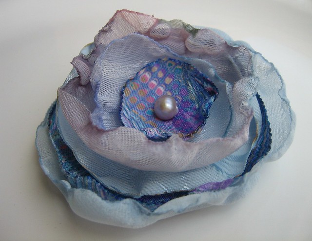 blue rose hair clip Fun blue violet fabrics with a mauve pearl in the 