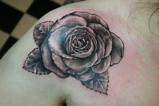 black and grey rose tattoo by