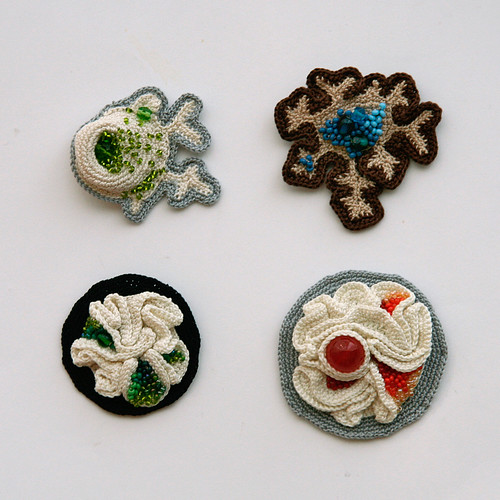 Four new brooches