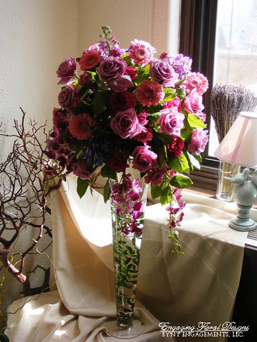 Tall Rose Gerbera and Orchid Centerpiece A round tall arrangement of cool 
