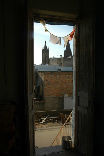 The view from my hallway, Catholic Church, Tibetan Prayer Flags, 100 year old private house, Guadalajara, Jalisco, Mexico by Wonderlane