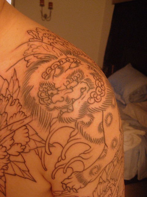 Front shoulder view of foo dog Tattoo and Co Artist Javier Acero