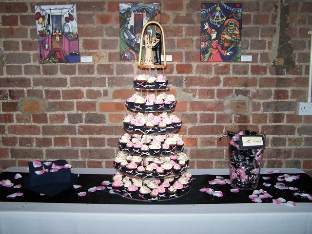 with butter icing and decorations for a pink and black themed wedding