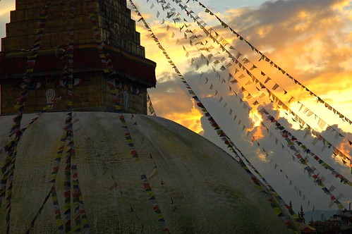 Sunset at Boudha Stupa, prayer flags fluttering, clouds, Kathmandu, Nepal by Wonderlane