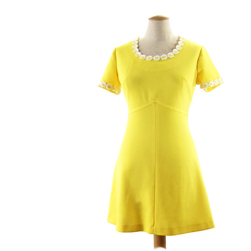 Vintage bright yellow mini dress with white daisy trim.