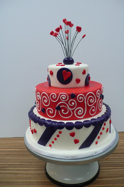 Purple red and white circus wedding cake
