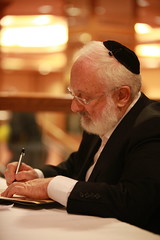 Rav is signing books, First day