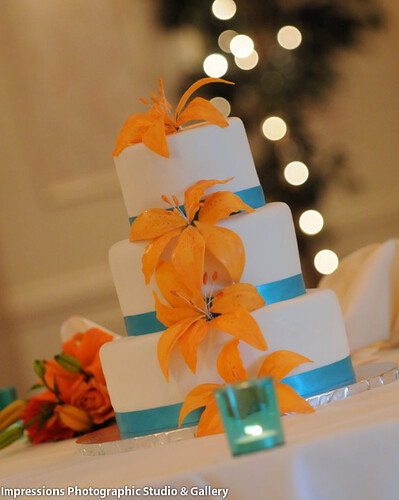This is a wedding cake I made recently I created tiger lilies out of gum 