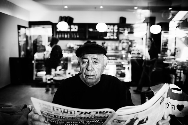a man reading the "Israel Today" newspaper