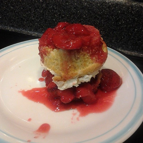 Strawberry shortcake made easy. Slice a cupcake in half, place strawberries on bottom half. Flip top with frosting over and add more strawberries on top.