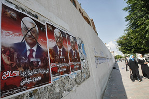Palestinians in Gaza have put up posters criticizing Abbas for blocking international action against the state of Israel. by Pan-African News Wire File Photos