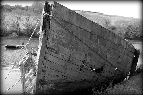 Abandoned fishing boat, beached at Coombe, River Fal, Cornwall by Claire Stocker (Stocker Images)