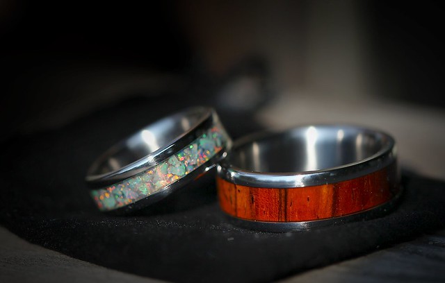Our Titanium Wedding Rings Lori 39s ring has an opal inlay mine has cocobolo
