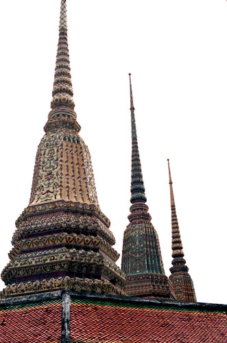 Ornate, detailed, and wonderfully decorated spires of Buddhist Shrines, roof, pilgrimage, downtown Bangkok, Thailand, 1993 by Wonderlane
