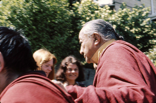 His Holiness Dilgo Khyentse walking, two students in background, Tour of HH Dilgo Khyentse Rinpoche at Sakya Ward St Dharma Center, Seattle Washington USA 1976 by Wonderlane
