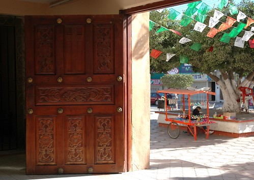 Carved Wood Church Door and view of the courtyard, Los Cruz, Jalisco, Mexico by Wonderlane