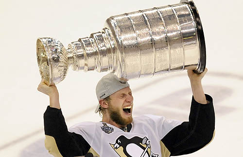 Center Jordan Staal screams with joy as he hoists the Stanley Cup after 