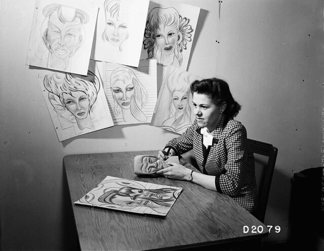 1944 WOMAN WITH ART WORK