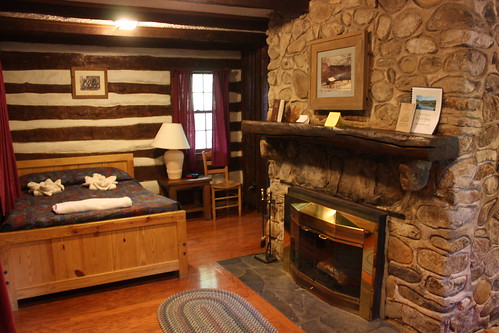 Cabin 20 is a one room cabin with a double bed and stone fireplace.