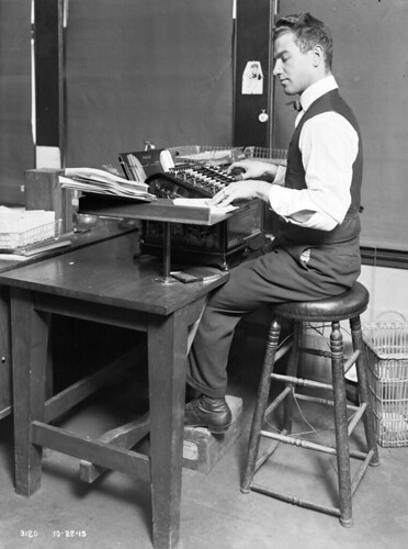 Engineering Department clerical worker at adding machine, 1915