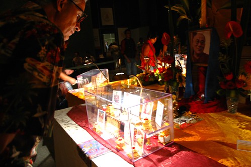 Visitors view Tibet Relics, Portrait of His Holiness the Dalai Lama in background, Expo Guadalajara, Jalisco, Mexico by Wonderlane