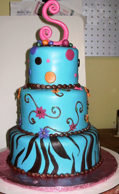 3 tiered fondant cake with turquoise chocolate brown fuschia purple and 