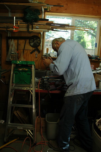 John Wieczorek (Vichorek) milling a wooden piece to fix a table, tool room, Sakya Monastery of Tibetan Buddhism, Seattle, Washington, USA by Wonderlane