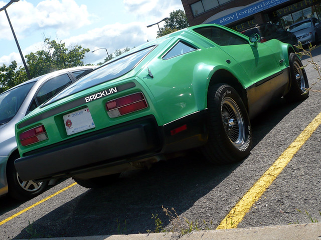 This is a Bricklin SV1 Safety Vehicle One parked in the parking lot of a